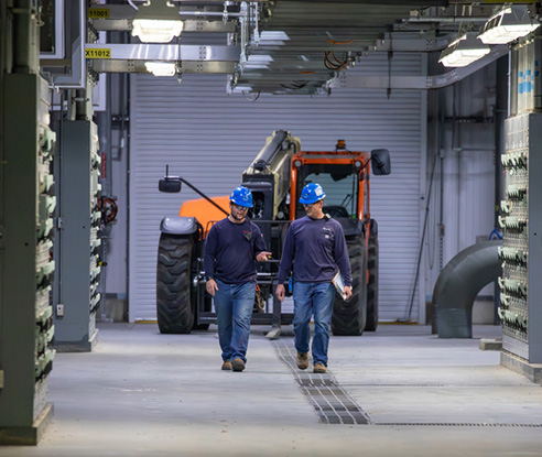 Employees walking at Deer Creek Station
